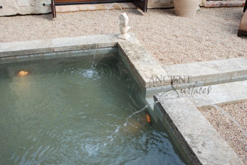 The legendary antique wall fountain, stone channel and coy pond combination, commissioned and realized by Ancient Surfaces, installed in Irvine California. Has been featured in many showcase home tours as well as on the front covers of national shelter magazines. www.AncientSurfaces.com