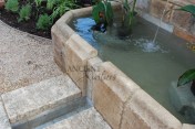 The legendary antique wall fountain, stone channel and coy pond combination, commissioned and realized by Ancient Surfaces, installed in Irvine California. Has been featured in many showcase home tours as well as on the front covers of national shelter magazines. www.AncientSurfaces.com