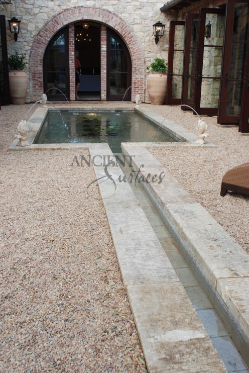 The legendary antique wall fountain, stone channel and coy pond combination, commissioned and realized by Ancient Surfaces, installed in Irvine California. Has been featured in many showcase home tours as well as on the front covers of national shelter magazines. www.AncientSurfaces.com