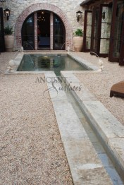 The legendary antique wall fountain, stone channel and coy pond combination, commissioned and realized by Ancient Surfaces, installed in Irvine California. Has been featured in many showcase home tours as well as on the front covers of national shelter magazines. www.AncientSurfaces.com