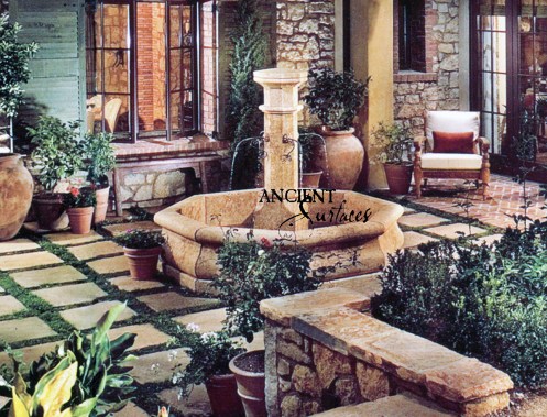 An Octagonal antique Limestone Pool Fountain By Ancient Surfaces in an Irvine California Home.