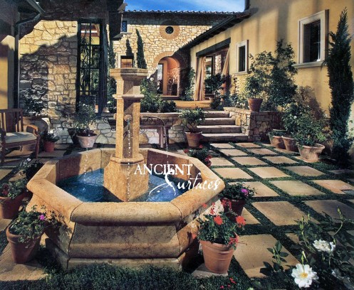 An Octagonal antique Limestone Pool Fountain By Ancient Surfaces in an Irvine California Home.