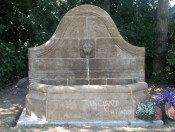 Antique lion head wall fountain by Ancient Surfaces.