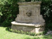 Antique Cherub head wall fountain by Ancient Surfaces.