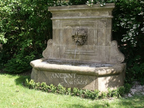 Antique Cherub head wall fountain by Ancient Surfaces.