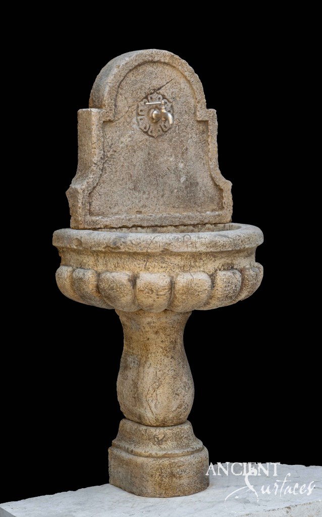 reclaimed limestone wall fountain
Ancient Surfaces wall fountain
antique limestone water feature
lion head limestone fountain
architectural stone wall fountain
baroque carved limestone basin
Mediterranean limestone wall fountain
Romanesque limestone spout
historic limestone fountain design
wall-mounted stone water feature
classical limestone garden element
sculptural reclaimed limestone
antique wall fountain series
limestone courtyard water fountain
reclaimed ancient limestone